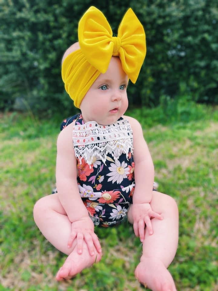 Baby Girl Outside with Yellow Velvet Bow and Romper 